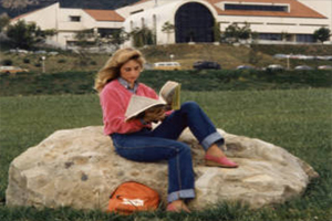 A student studies at Alumni Park, c. 1980