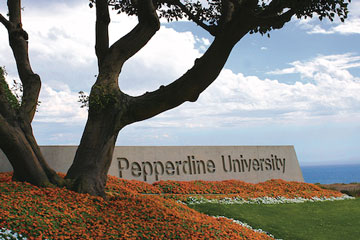 Pepperdine University sign besides a large tree