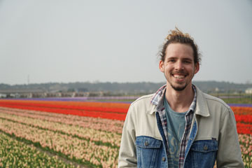 Seaver Senior Cullen Player pictured in a field of tulips