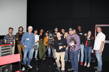 Professor Germano Saracco and his cinematography students posing for a photo at RED Studios