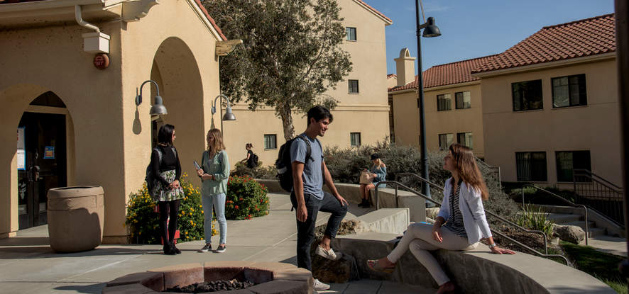 Seaver students sitting and walking around Malibu's upper campus