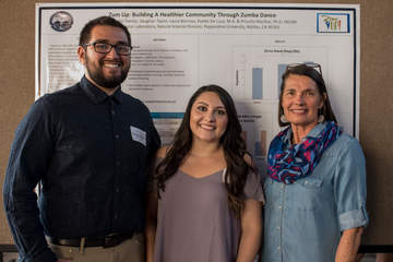 Seaver students in front of their poster presentation