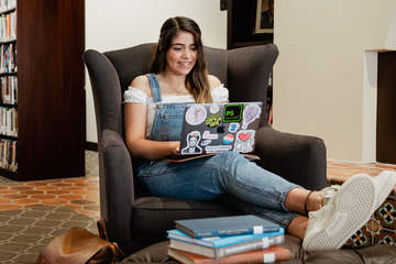 pepperdine student typing on computer