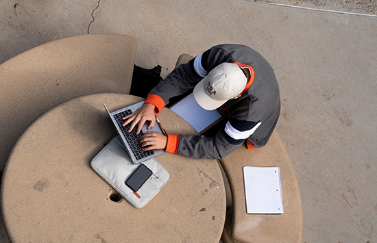 student working on laptop