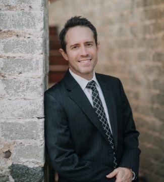 Ryan Board's head shot against a dark background