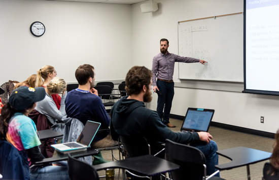 Faculty teaching in front of a class