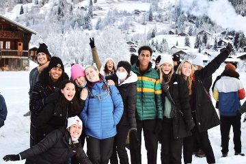 Seaver students pictured in front of snow-covered mountains in Lausanne, Switzerland