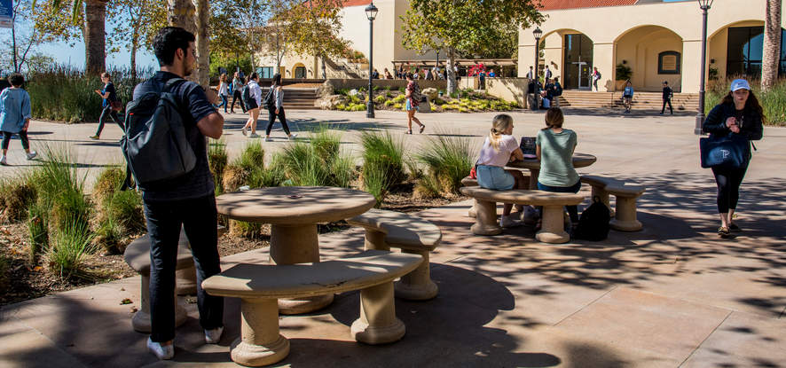 Students walking around Mullins Town Square