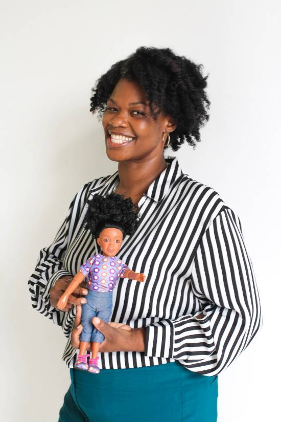 Flora Ekpe Idang holding a doll