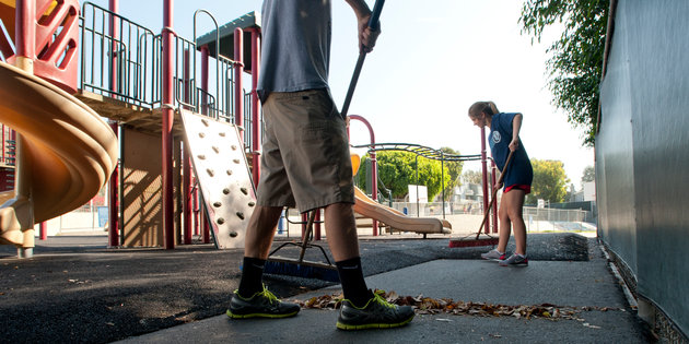 Students Sweeping Playground