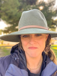 Seaver alumna Charlotte Gaetz pictured in a hat