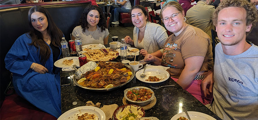 Students eating at a restaurant for Arabic class