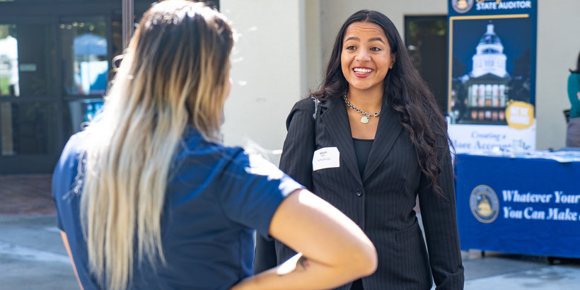 Student dressed professionally at career fair