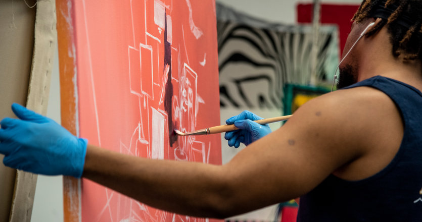 Seaver student painting a canvas