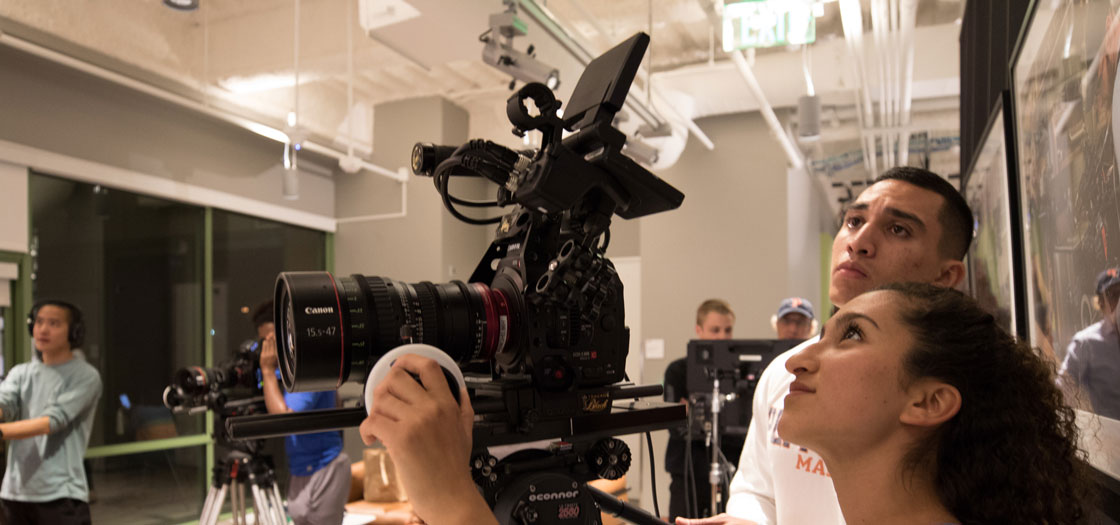 Seaver students operating a Canon video recorder