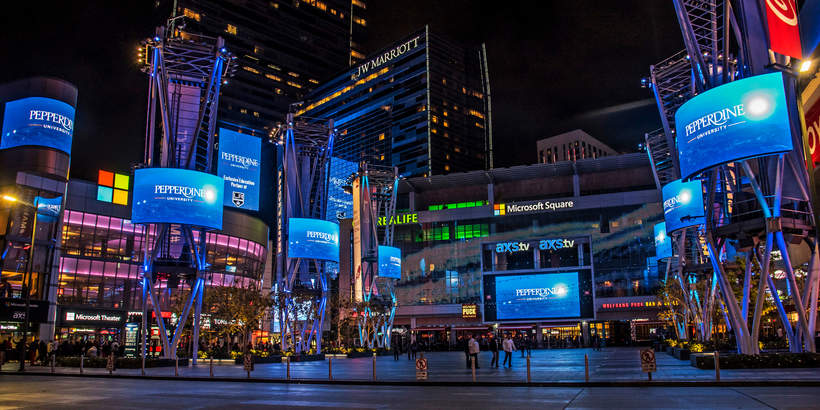 LA Live at night with Pepperdine screens