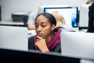 Student staring at computer in class