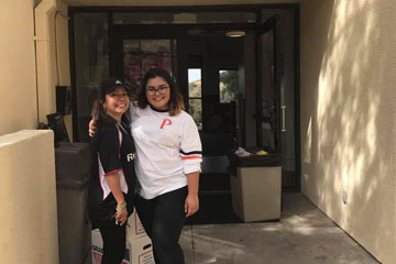 Isabel and her mom outside a residence hall