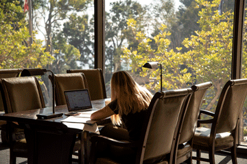 Student studying in Payson library