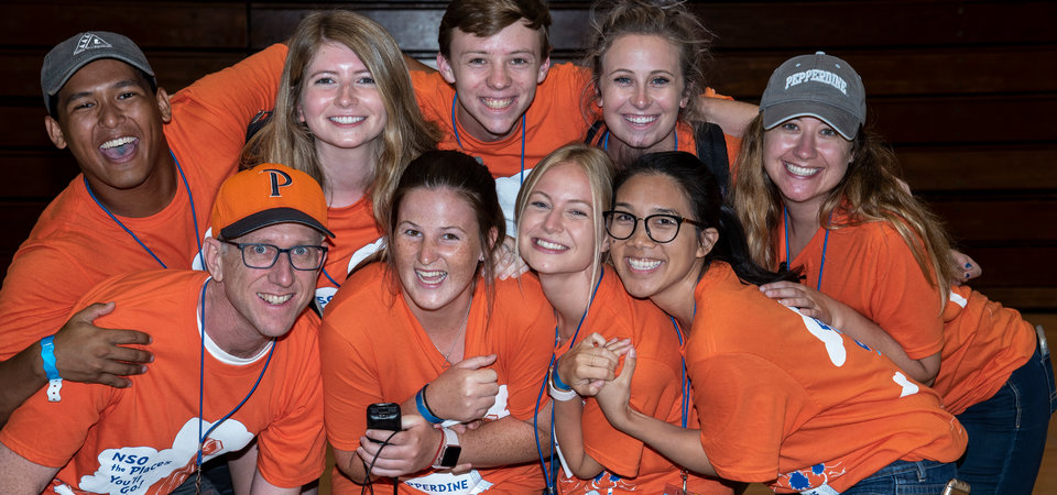 Orientation leaders huddled together for New Student Orientation