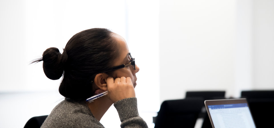 Female student thinking in class