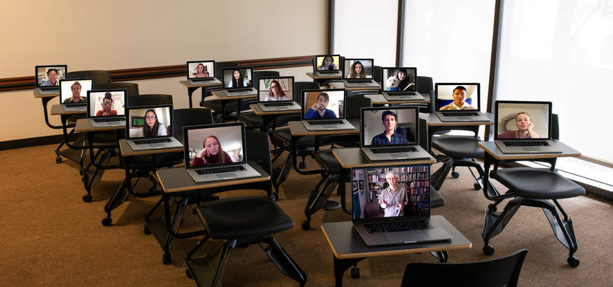 Classroom with open laptops depicting remote learning