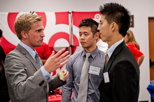 Two students networking at a job fair