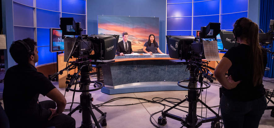 Students behind the camera in the NewsWaves studio