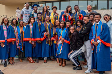LOQUI graduates in cap and gown