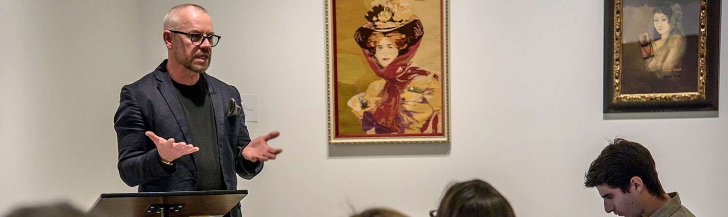 Lecturer speaking in an art museum