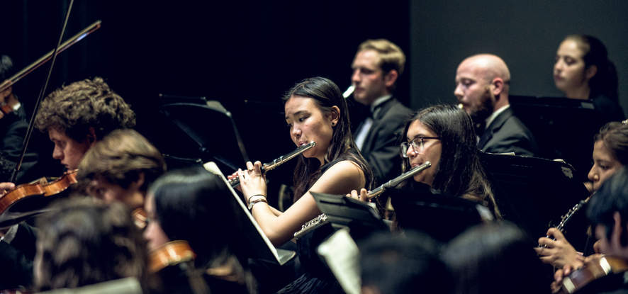 Seaver student playing in the orchestra