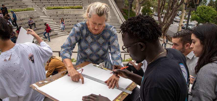 Pepperdine students taking an outside art class, looking at a blank canvas