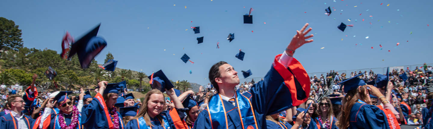 Graduation caps tossed in the air