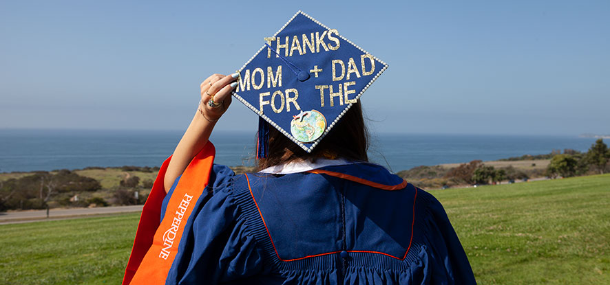 Graduation cap reading "Thanks Mom and Dad for the World"