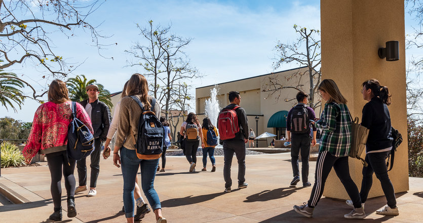 Students walking around Mullins Town Square