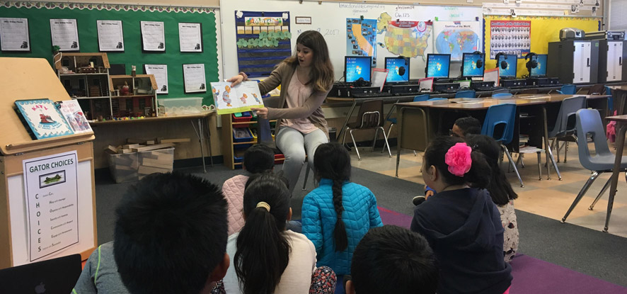 Teacher Candidate Reading to Children