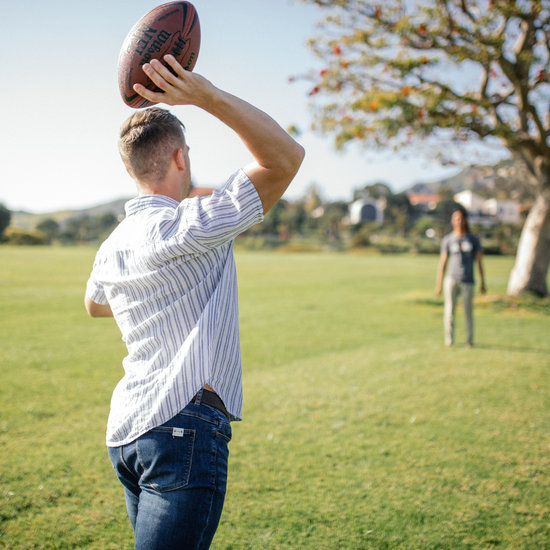 Athletes play catch with a football