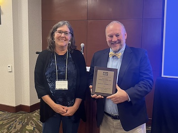 Robert Williams receiving the Ole R. Holsti Distinguished Scholar Award