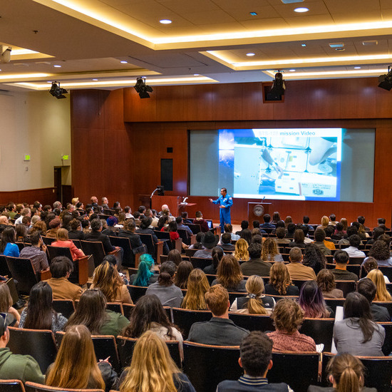 Folks listen to a lecture in Elkins Auditorium