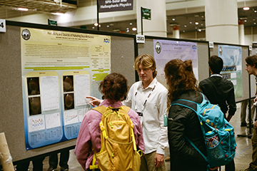 Seaver physics student explaining daytime-occurring auroras