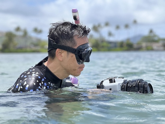 Paul Kim in the ocean filming