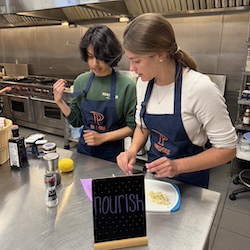 Students collaborating over a dish
