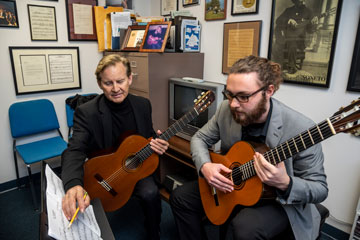 Christopher Parkening works with a student