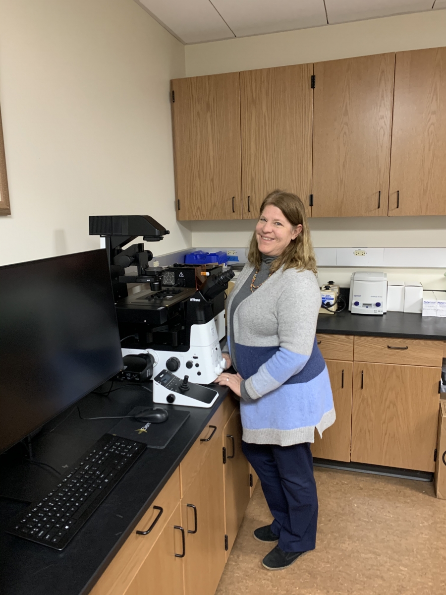 Susan Helm with new microscope equipment