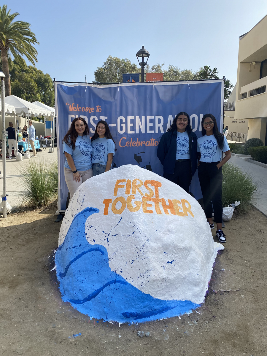 Students in front of first-generation poster