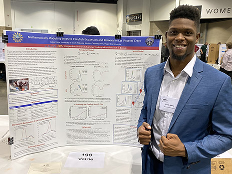 Caleb Valrie presenting poster at Joint Mathematics Meeting