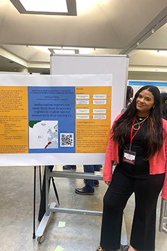 Velez sharing research alongside her poster