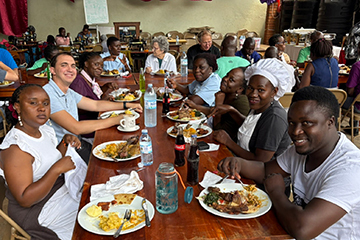Jake Nichols dining with fellow Kibo Group members