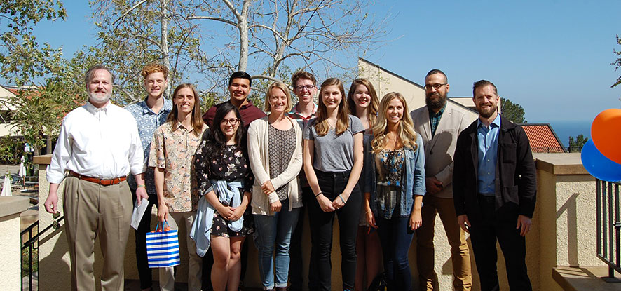 Seaver students from the Philosophy Club are gathered in Malibu