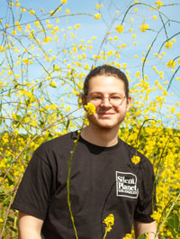 Noah Racy pictured amongst yellow wildflowers